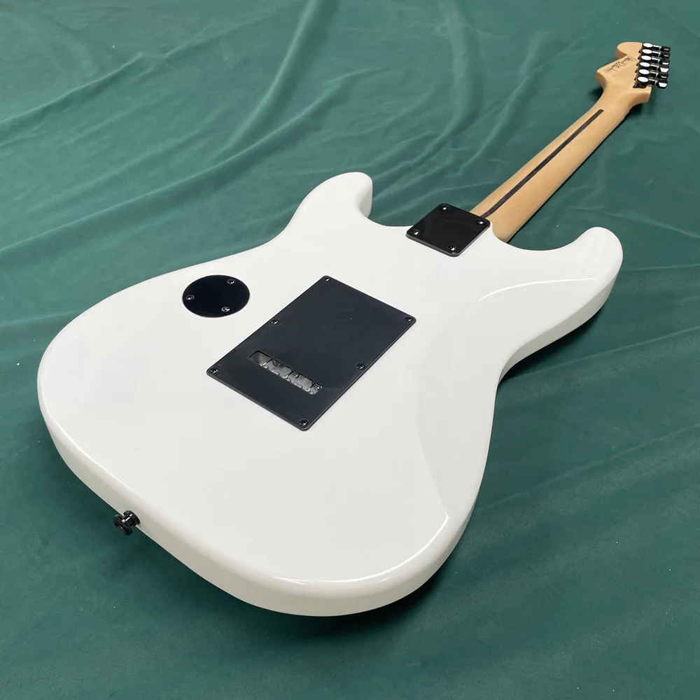White 6-string electric guitar, with high gloss finish, guitar solo, double tremolo and double coil pickups