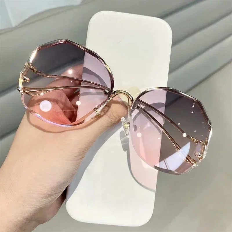 

Fashion Photochromic Sunglasses Women’s Frameless Metal Curved Temples Irregular Round Gradient Sunglasses Women Sun Glasses