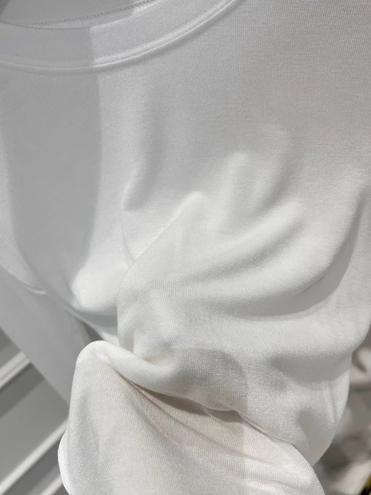 เสื้อยืดแขนยาวซีทรูเซ็กซี่สำหรับผู้หญิง ทรงเข้ารูป เสื้อชั้นในสำหรับผู้หญิง เสื้อครอปชายไม่เท่ากันสำหรับฤดูใบไม้ผลิ เสื้อยืดเข้ารูปสีพื้นอเนกประสงค์