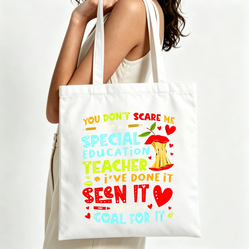 Women's slogan-style graphic canvas tote bag with apple design, perfect for daily shopping and casual outings