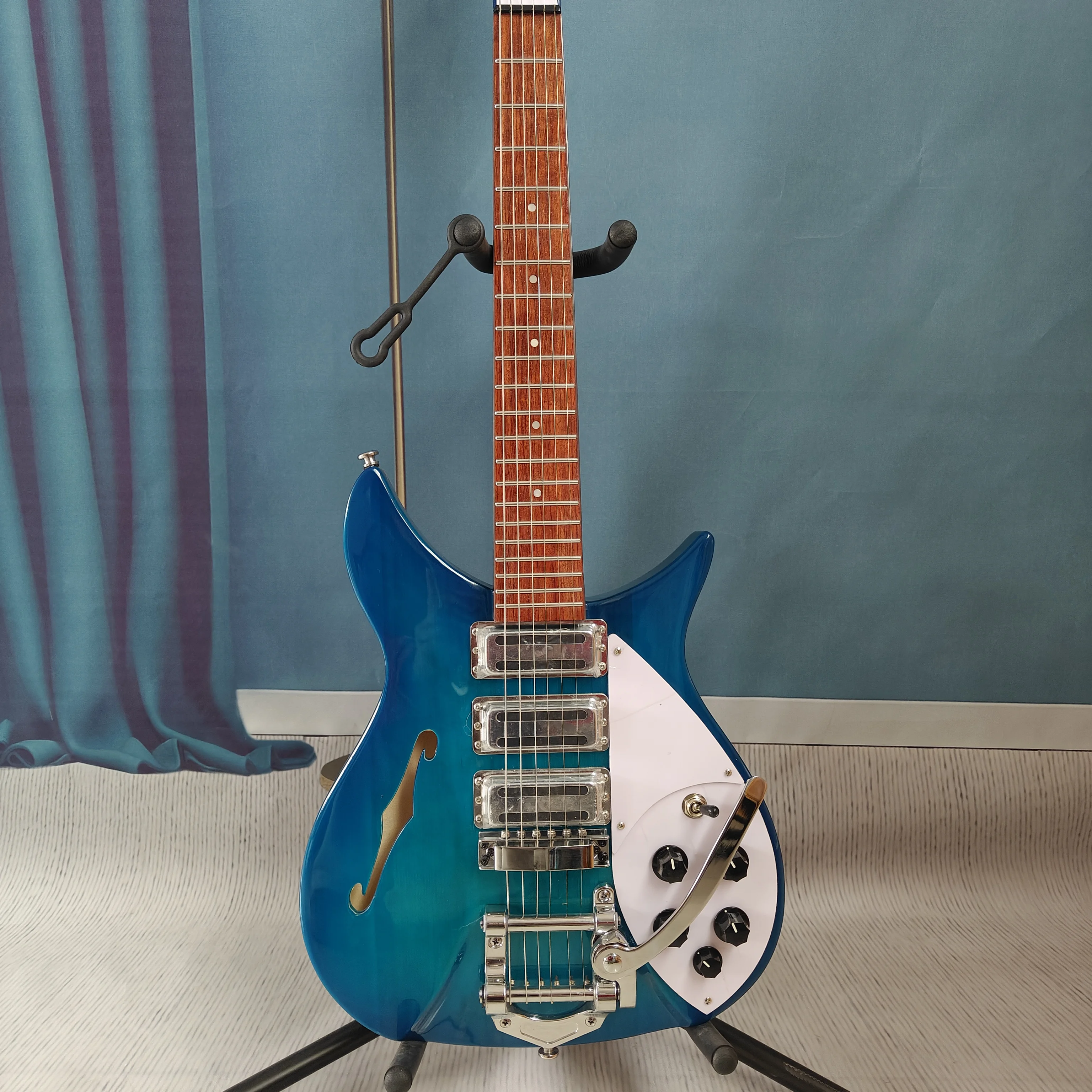 

A high-quality original electric guitar with stainless steel frets, a maple neck, a semi-hollow body, right-handed design, suit