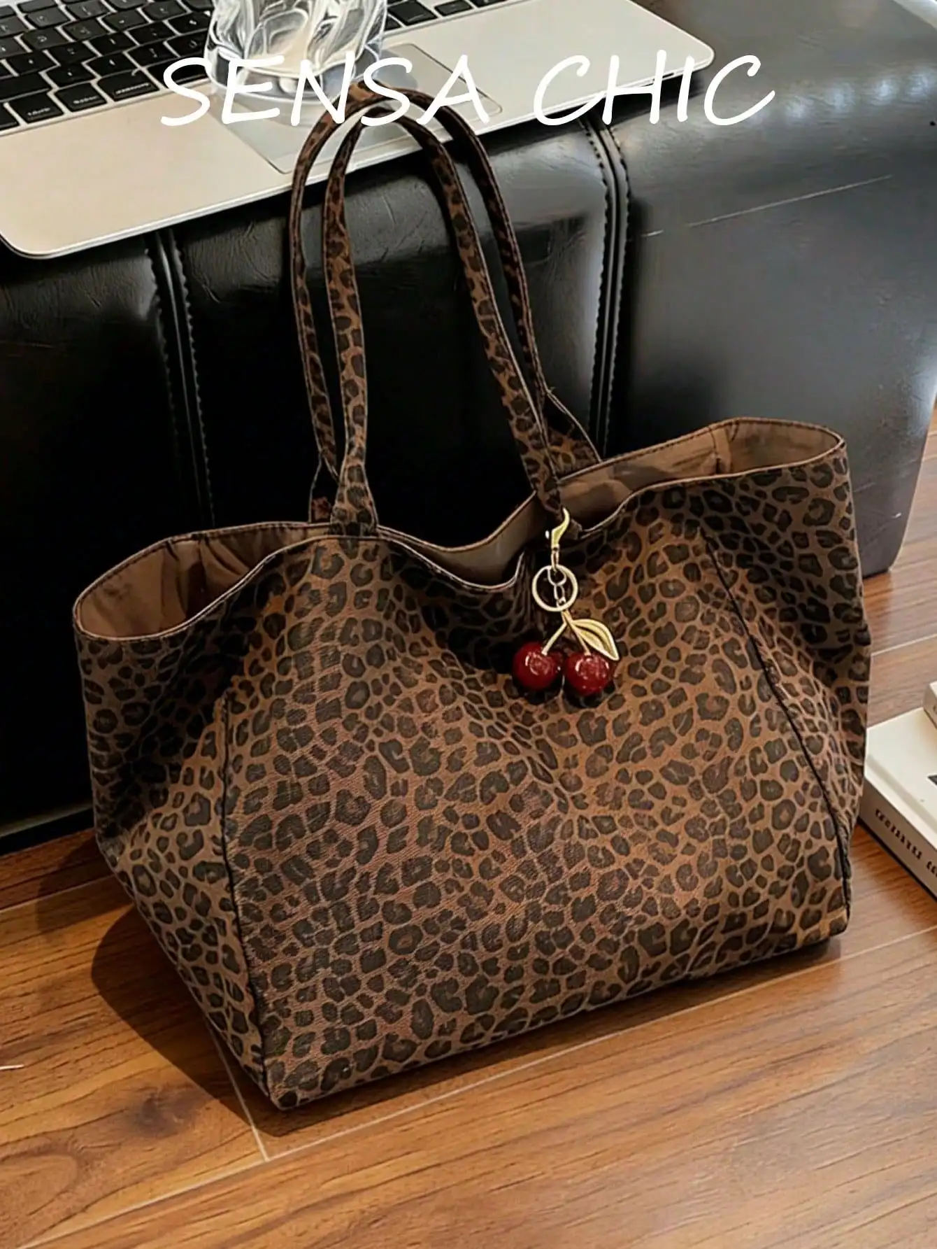 Large Capacity Women's Brown Tote Bag With Red Cherry Pendant. Featuring Leopard Print Design And Sturdy Dual Top Handles