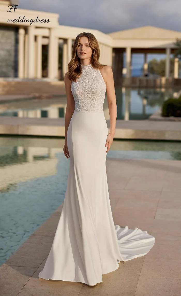 

Custom-made elegant lace applique beaded satin A sleeveless high-neck wedding dress for the bride, exuding a sense of high-end s