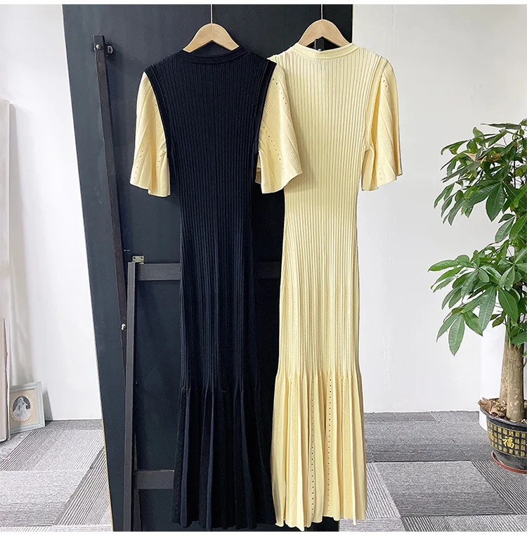 

Knitted long skirt black and white contrasting hollow out dress, elegant and fragrant, slim fit women's early spring 2024 new