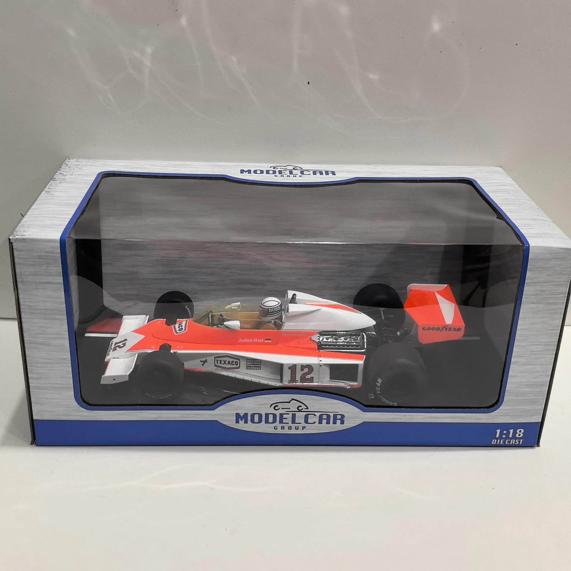 다이캐스트 MCG 1/18 Slcae 맥라렌 포드 M23 # 12 1976 F1 D3W5 맥라렌 포뮬러 자동차 합금 자동차 모델 소장 장난감 선물 기념품
