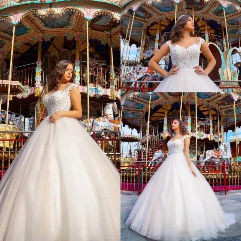 2025 Elegant Beach Wedding Dresses Capped Sleeves Lace Appliques A Line Tulle Bridal Gowns Cheap Wedding Gowns