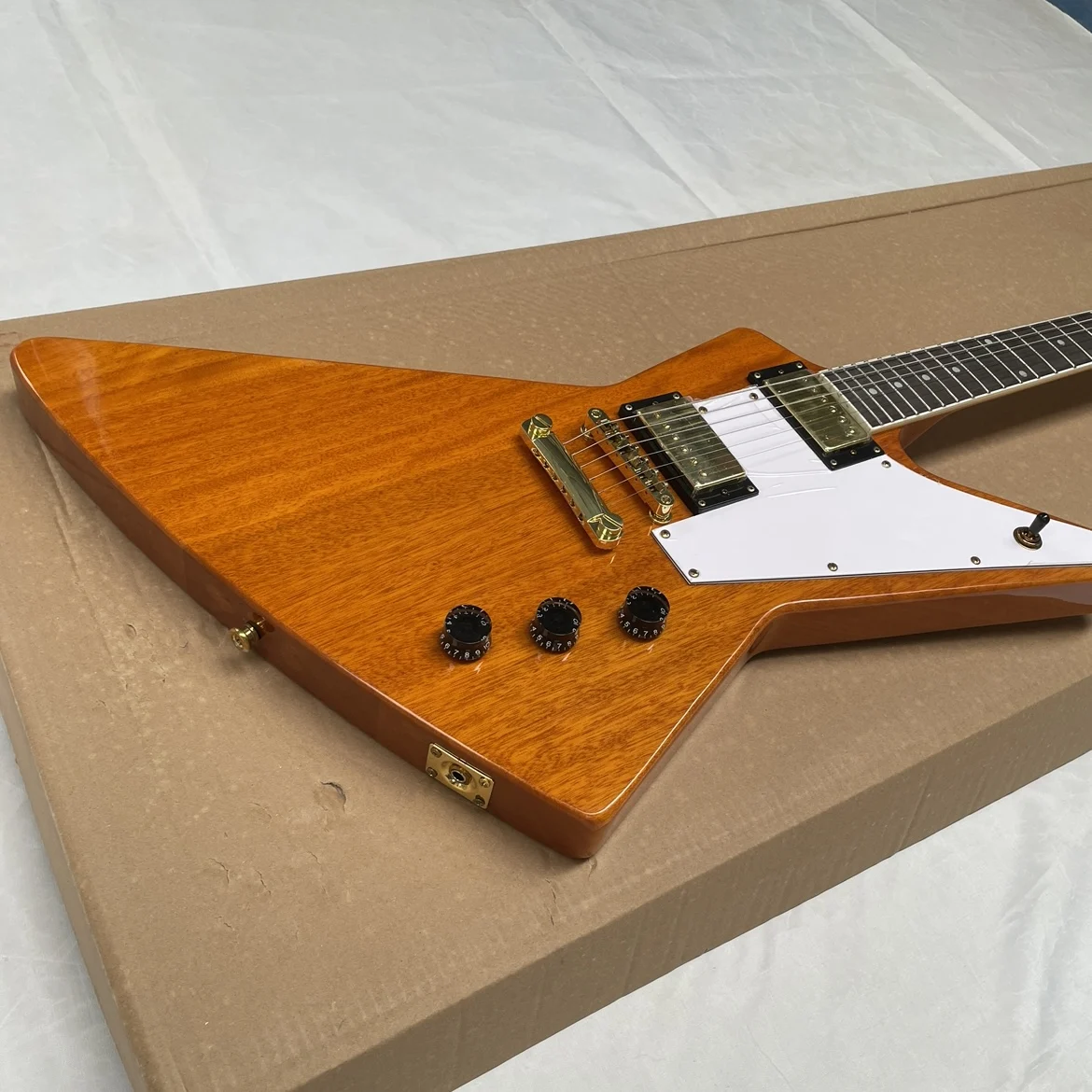 A six-string transparent yellow electricguitar with a white pickguard and gold hardware guitars.Professional performanceguitarra view 4