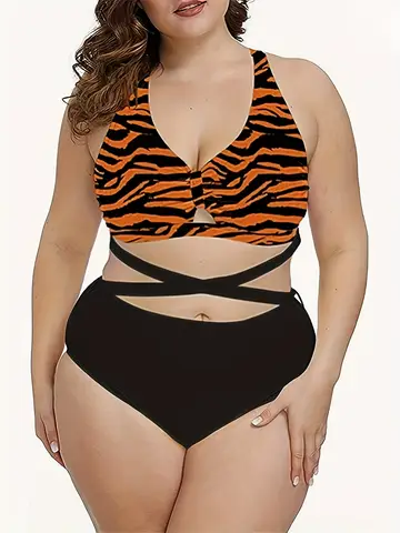 Women's plus-size bikini with crisscross straps and zebra print, vacation style.