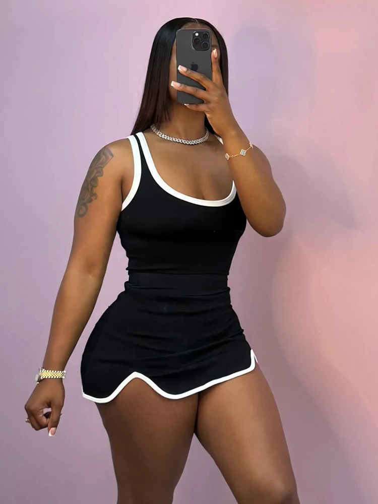 Macheda カジュアルトラックスーツ 2 点セット女性コントラストパッチワークスキニータンクトップ + 不規則な裾スカートデイリーファッションスポーティな衣装