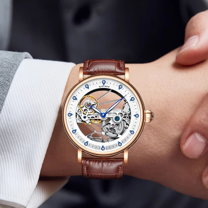 KINYUED العلامة التجارية الجديدة الفاخرة تصميم جوفاء الهيكل العظمي ساعة ميكانيكية للرجال حزام من الجلد مقاوم للماء موضة ساعات أوتوماتيكية رجالي
