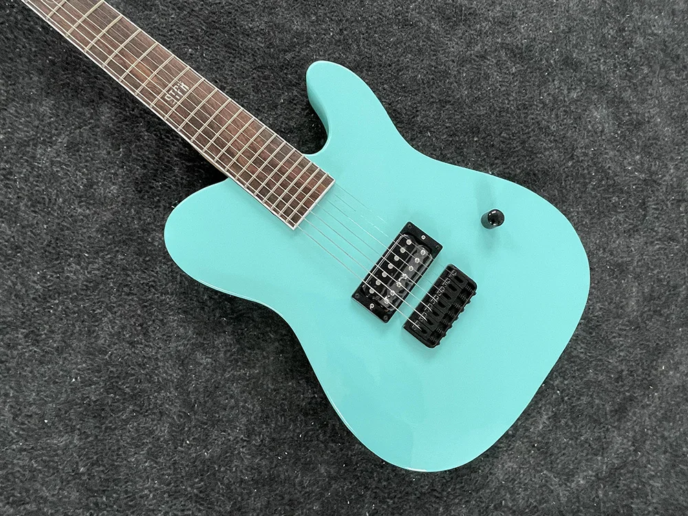 high quality classic 7 string electric guitar, seafoam green body, black accessories,  free delivery