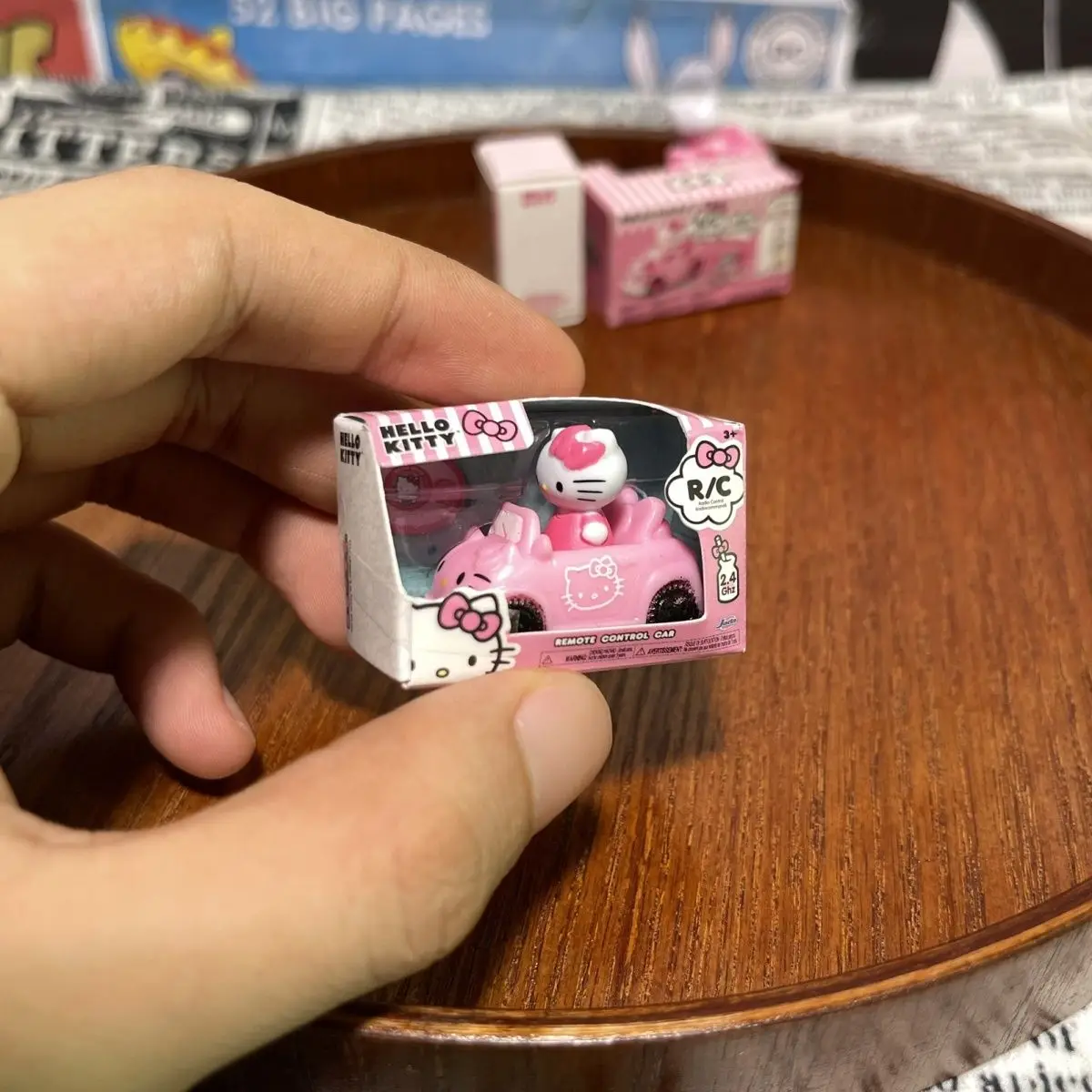 Cartoon Figurine Hello Kitty Mini RC Car 1:64 Scale Cute Pink Vehicle Anime Figure Character Toy Car Action Figure Collection view 2