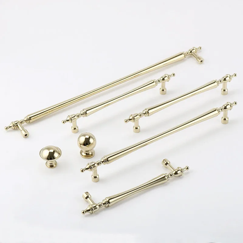 Long and short gold brass pulls displayed together