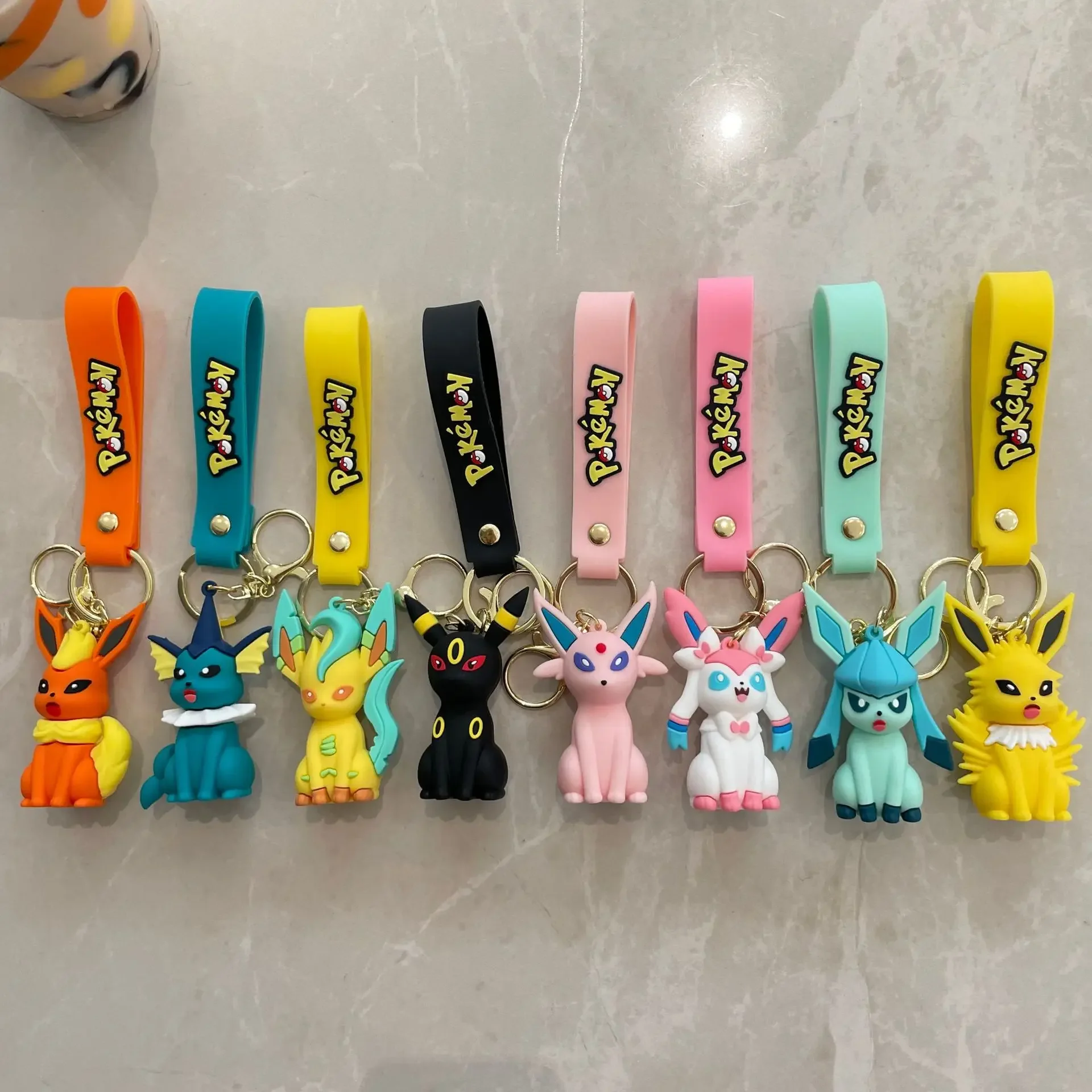 8 estilo pokemon eeveelution chaveiro bonito elfo anime figura mochila encantos decorações de festa modelos boneca crianças brinquedos presentes aniversário