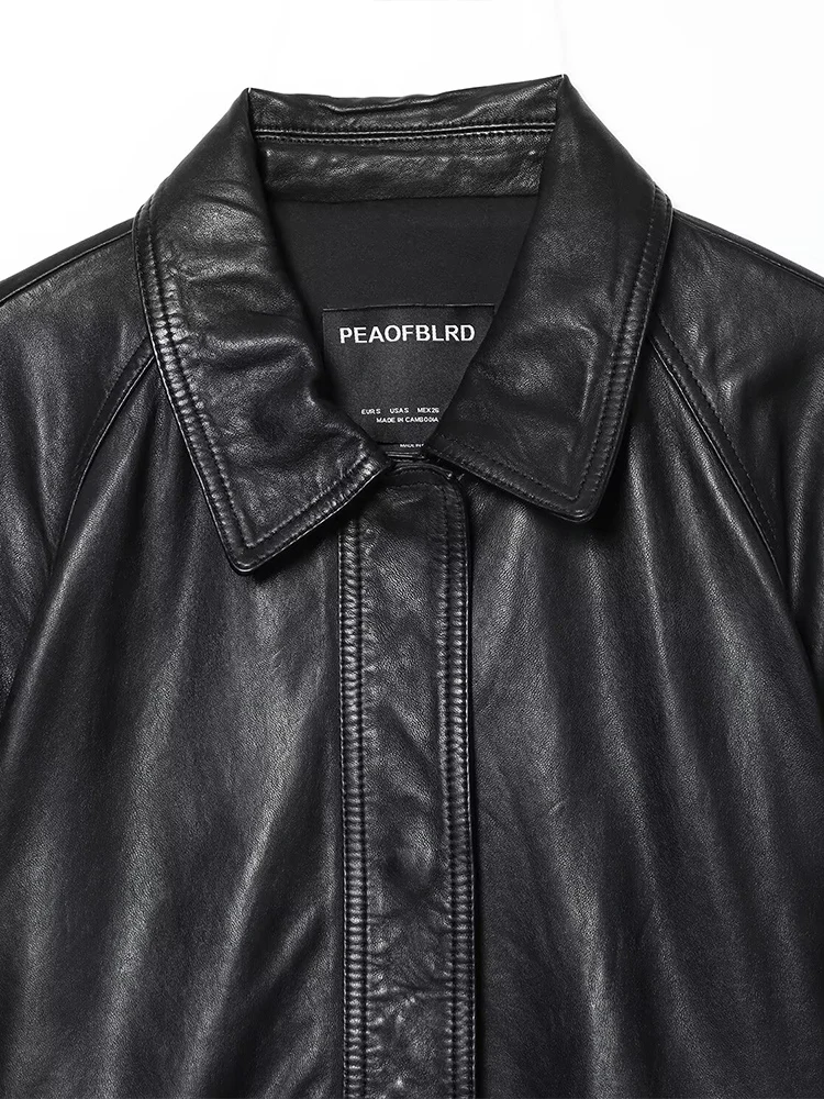 Estilo europeu novo feminino elegante e versátil cor sólida lapela manga comprida jaqueta de couro com cinto curto.