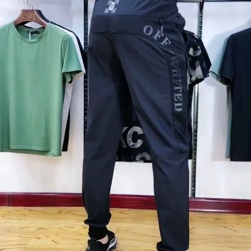 Elastic Force Men's Pants Spring Summer Leisure Sports Pants Male Shredded Milk Leggings Light Thin Splicing Pocket