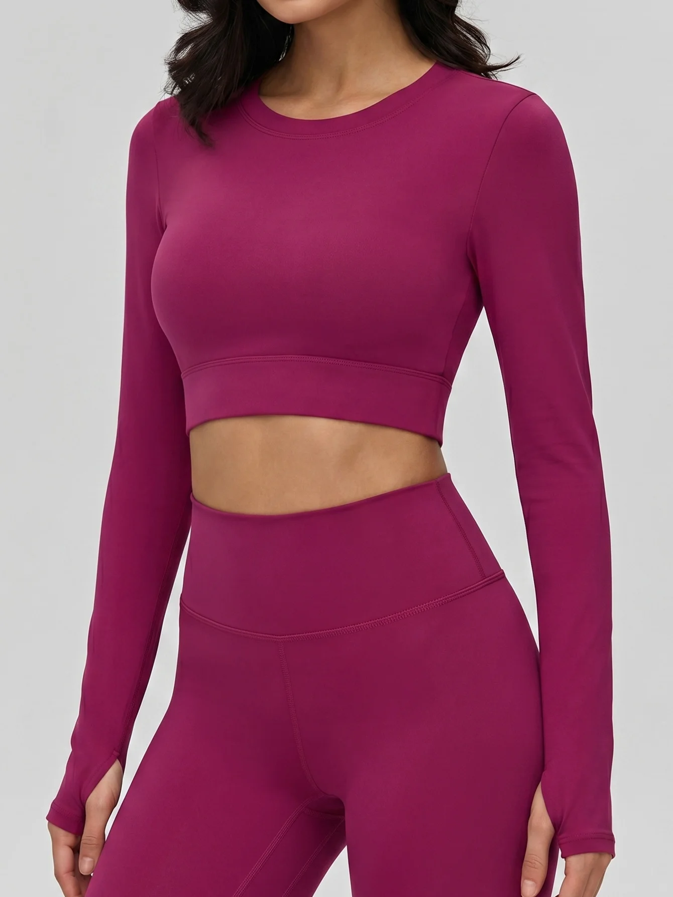 

Women's cropped long-sleeve workout top, slim fit yoga shirt with back cutout, semi-fixed waterdrop cups.