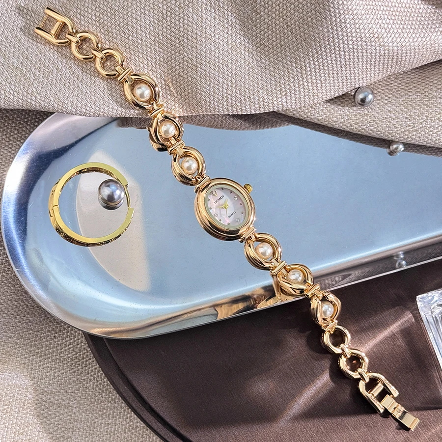 Ladies' silky texture Oval alloy case set with movable fine bead bracelet Sun Print rhinestone dial Elegant Lady quartz watch