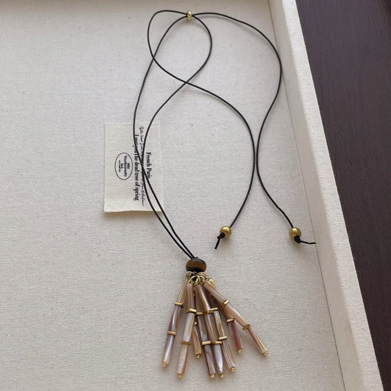 

Minar Stylish Shell Natural Stone Tiger Eyes Beads Tassel Strand Pendant Necklace for Women Long Adjustable Rope Sweater Chain