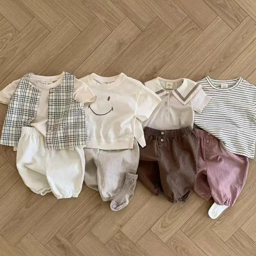 Pantaloni per bambini ragazzi coreani ragazze bambino traspirante tinta unita Versatile morbido Comfort elastico in vita 2024 bottone moda sciolto