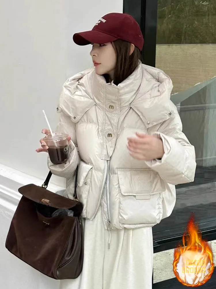 

Новинка зимы: Утепленная хлопковая куртка для женщин, свободного кроя, с капюшоном, теплая, с утолщенным дизайном, короткая верхняя одежда, пуховик из хлопка.