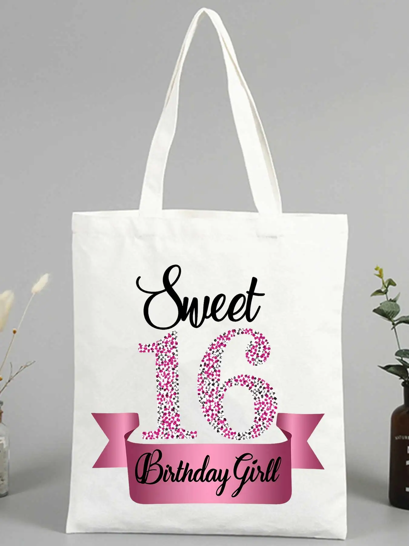 Sweet 16 Birthday Girl canvas tote bag with glitter text and ribbon design, perfect for birthday celebration and gift giving