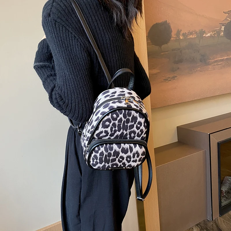 Mochila de lona con patrón de leopardo para mujer, bolso escolar de diseñador, bolsa de viaje, informal, versátil