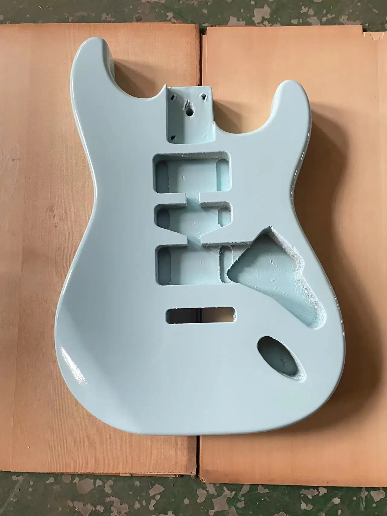 

The blue glossy guitar panel is an ST style electric guitar with a half empty heart barrel DIY guitar. The colored guitar body i