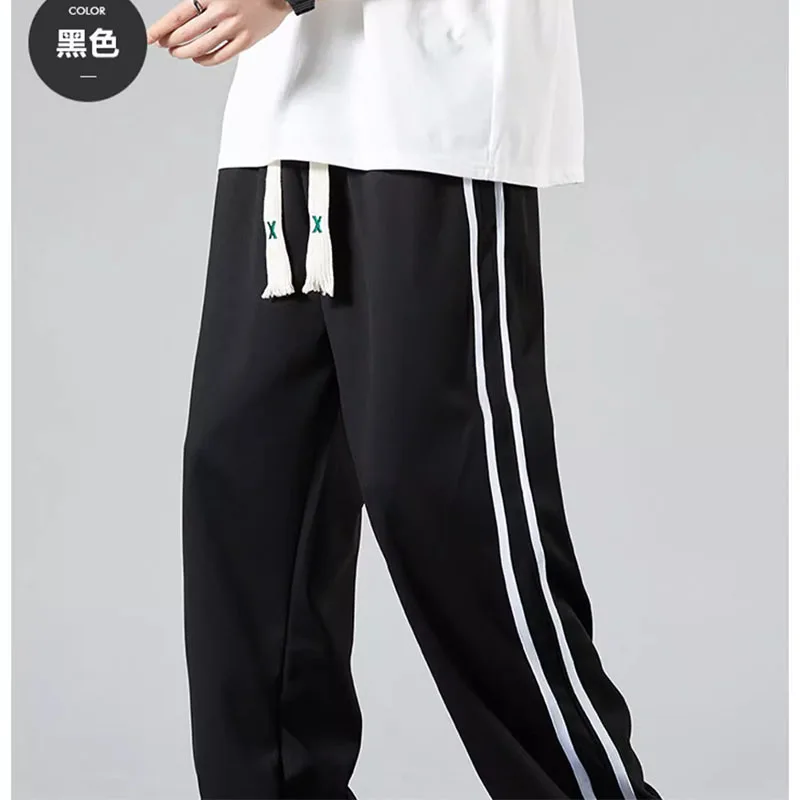 Pantaloni casual sportivi a righe versione coreana maschile della tendenza pantaloni moda gamba dritta per studenti di marca di moda allentati estivi