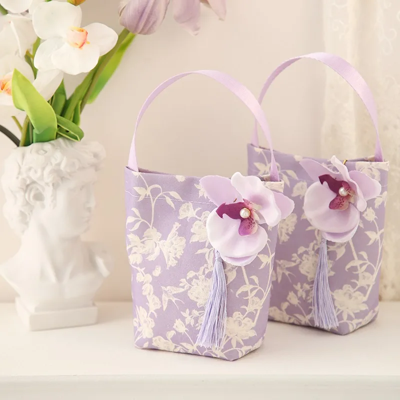 lilac-floral-fabric-wedding-favor-bag-handheld-gift-pouch-with-3d-orchid-tassel-decor-for-wedding-candy-guest-party-gifts