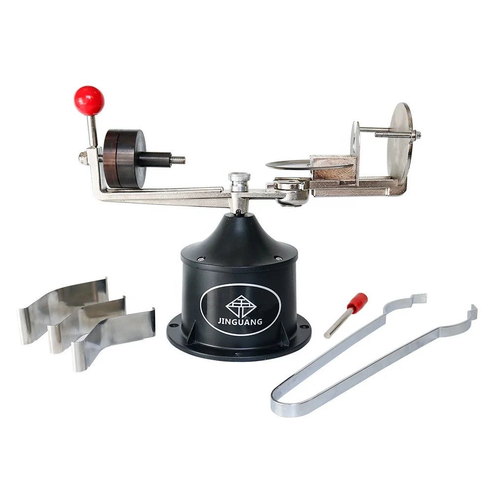 Dental laboratory equipment is a metal centrifugal casting machine with three brackets and a pair of pliers
