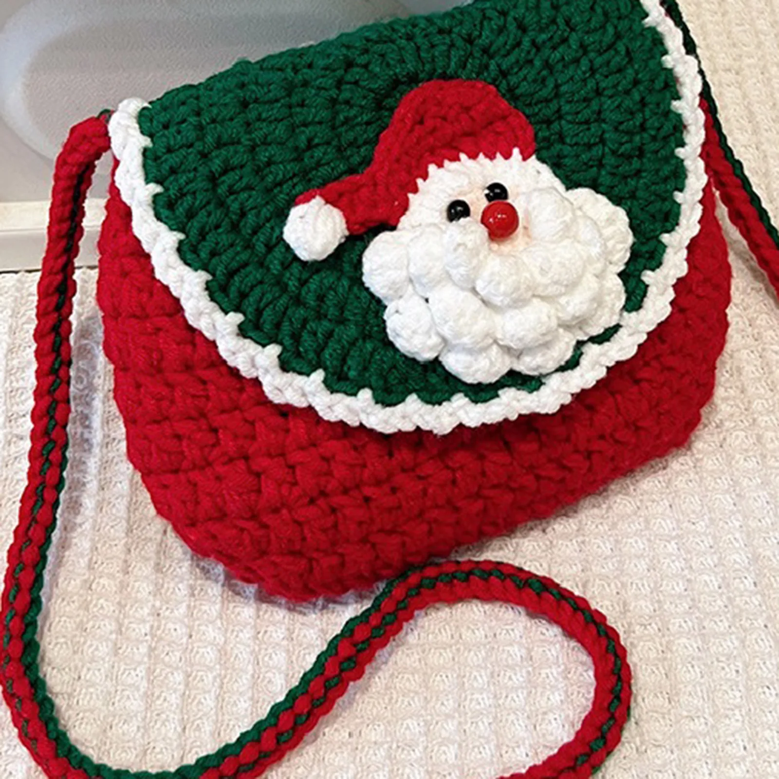 Festive Handmade Crochet Crossbody Bag – Christmas Edition, featuring Santa Claus and reindeer designs, in green and red colors,