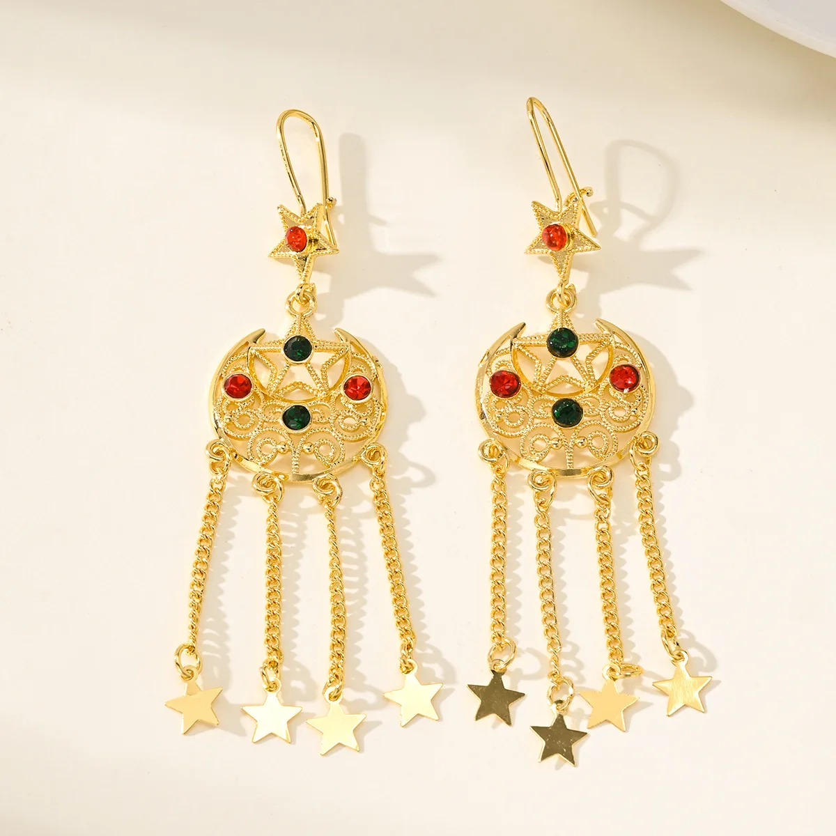 9999 gold Bohemian long-style star and moon fringed earrings for global travel, featuring scenes from Xinjiang and ethnic style