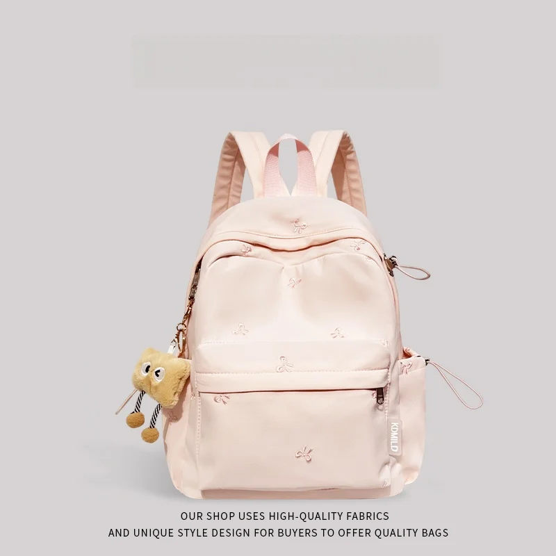 حقيبة مدرسية وردية اللون للفتيات جديدة 2025 المدرسة الثانوية بابا طبقة مزدوجة البوليستر المواد الداخلية سستة إغلاق استخدام الحرم الجامعي