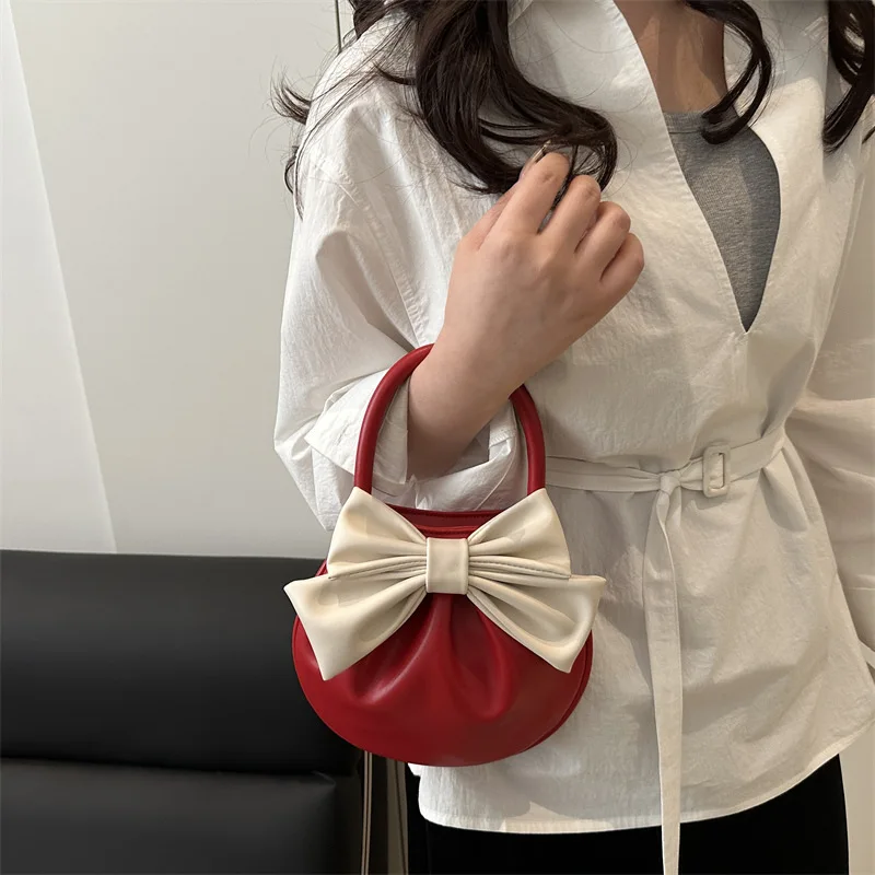 حقيبة ركاب بتصميم فاخر للنساء لربيع وصيف 2025 حقيبة يد أنيقة حقيبة سرج على شكل فيونكة للسيدات