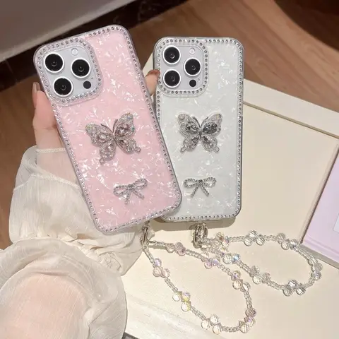 Custodia con diamanti per iPhone 17 Pro Max 11 12 14 13 15 16 Plus Farfalla di cristallo Catena corta Proteggi la copertura della cinghia del braccialetto glitterato