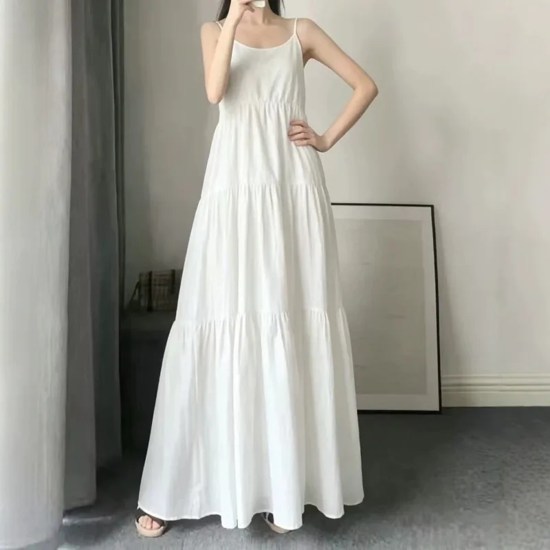 Robe longue maxi ample et fluide pour femme, sans manches, à fines bretelles, couleur unie, idéale pour les vacances, les stations balnéaires ou comme tenue de invitée de mariage