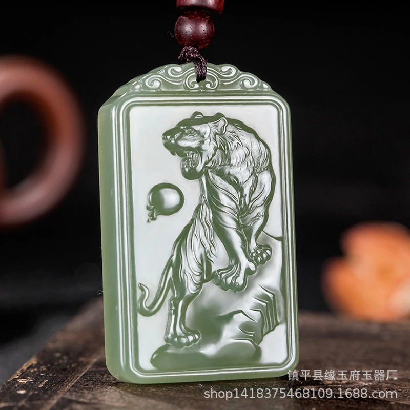 

Fine-grained Hetian green zodiac , mountain-climbing tiger jade pendant