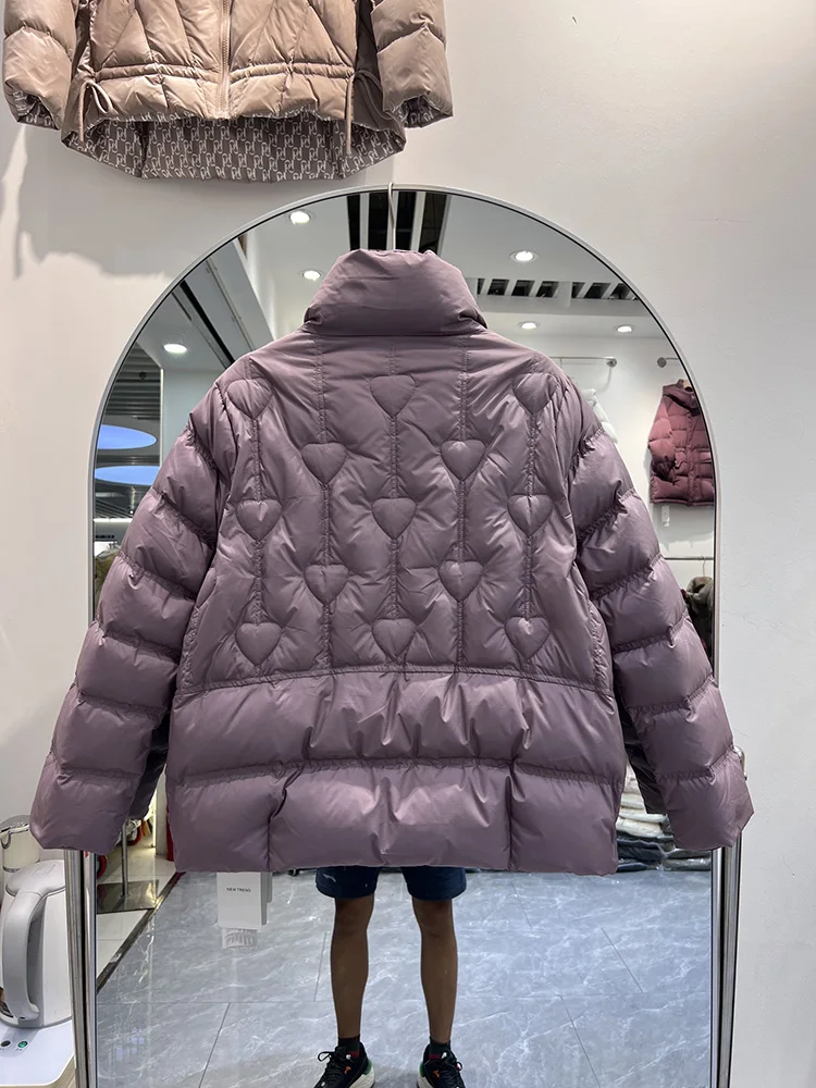 سترة نسائية شتوية جديدة لعام 2025 النسخة الكورية القصيرة بياقة واقفة على شكل قلب سترة كاجوال متعددة الاستخدامات من ريش البط الأبيض