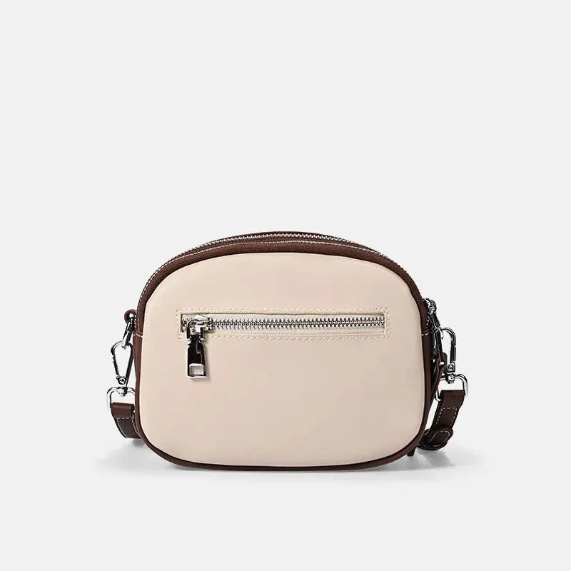 Bolso cruzado de cuero genuino para mujer, bolso redondo pequeño lleno de sensación avanzada, bolso de hombro versátil a la moda para mujer, nuevo 2025