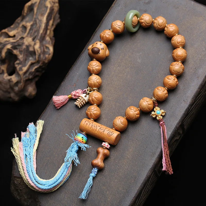 

Natural,unpainted cat's paw and monkey head bodhi bead set;handheld peachwood bodhi root withcircular grooves and recessedridges