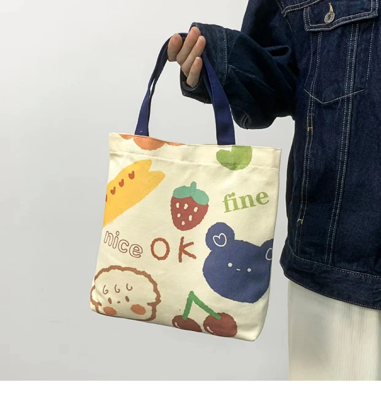 Bolso de lona con estampado de dibujos animados para mujer, bolsa de hombro ligera, versátil, soporte para compras, bolso de mano de moda para niñas