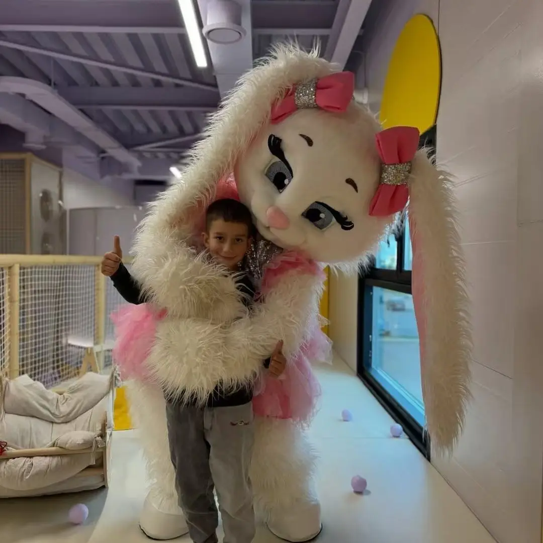 ชุดมาสคอตกระต่ายน้อยน่ารักสำหรับคริสต์มาส ชุดแฟนซีการ์ตูนกระต่ายขาว ชุดมาสคอตกระต่ายขนปุย ชุดแฟนซีสีชมพู