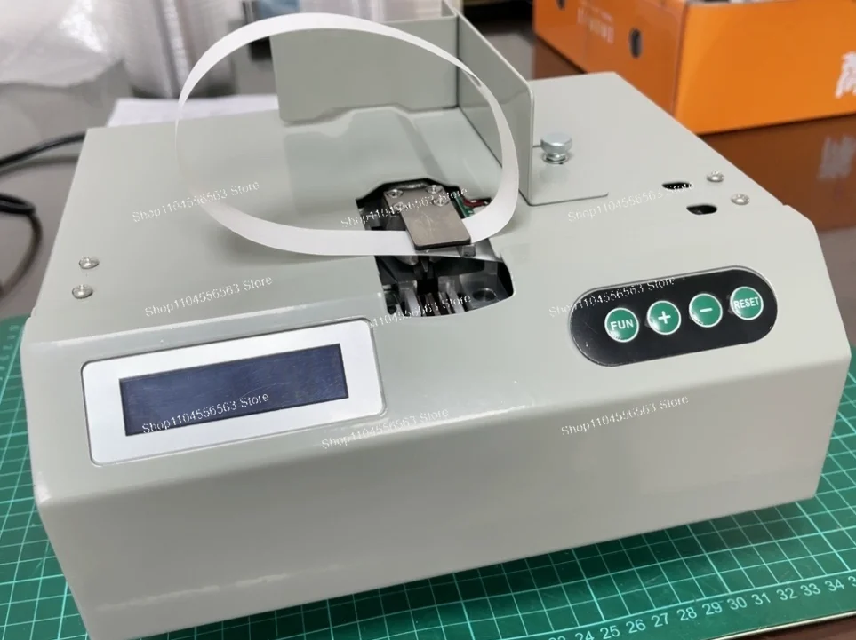 

110V/220V Automatic Paper Tape Strapping Machine for Cross Binding & Billet Banding Small Strapper for Currency & Packaging