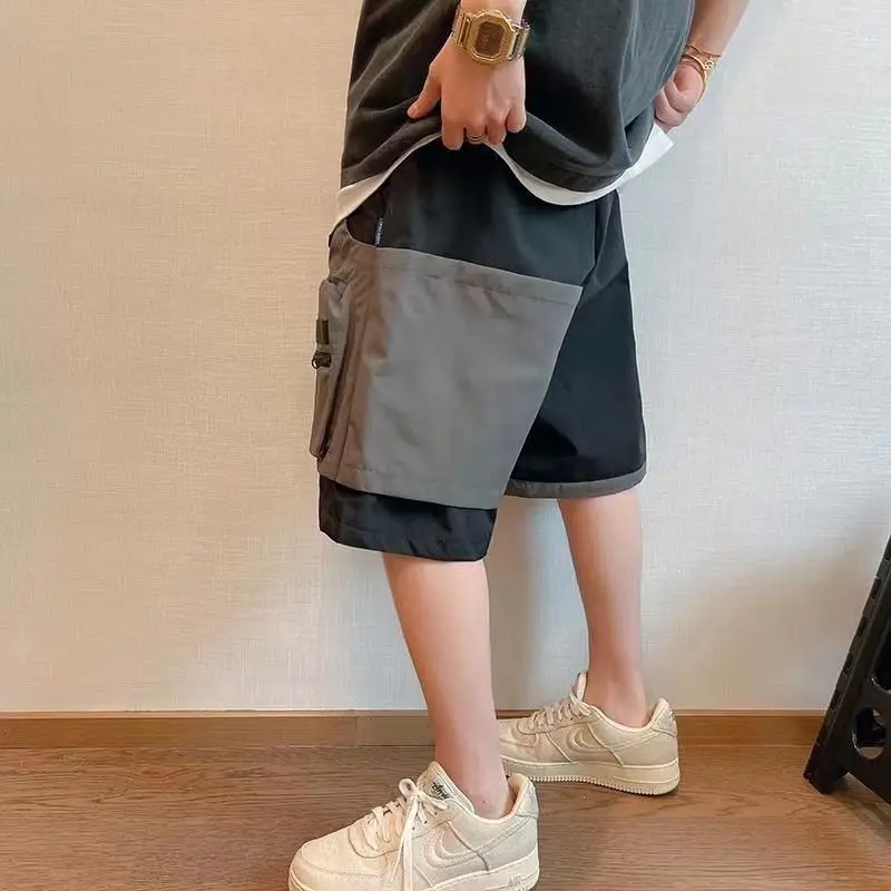 Pantalones cortos de trabajo de dos piezas con Bolsillo falso salvaje para hombre, pantalones sueltos de cinco pantalones, ropa de calle de