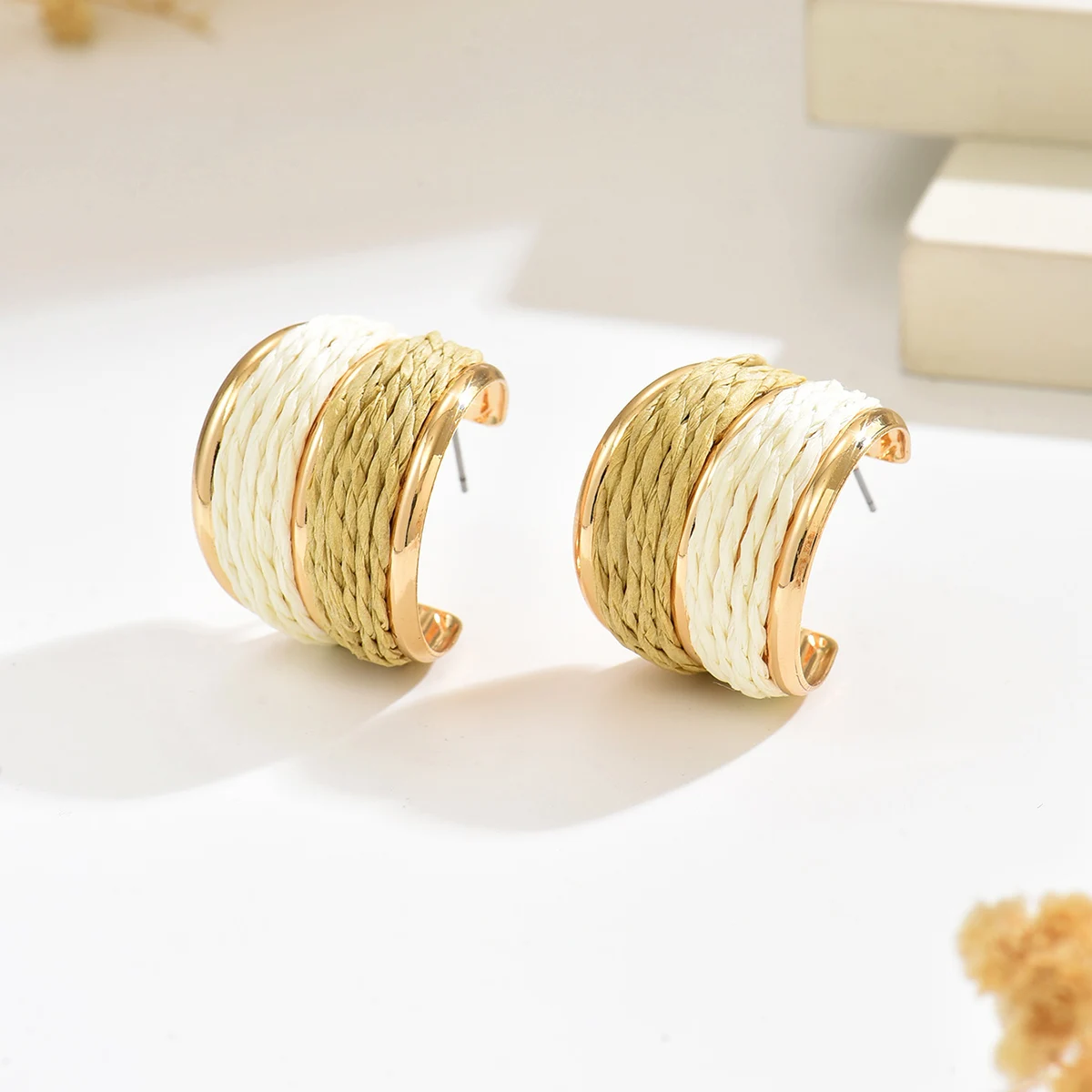 Bohemian-style beach vacation-inspired handwoven raffia C-shaped hoop earrings, perfect for women to wear on any occasion—from e