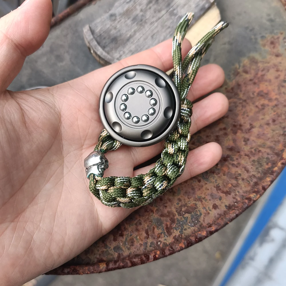 EDC عملة معدنية تململ سبينر دفع وسحب السقاطة اللمس الضغط تململ سبينر لعبة قلادة