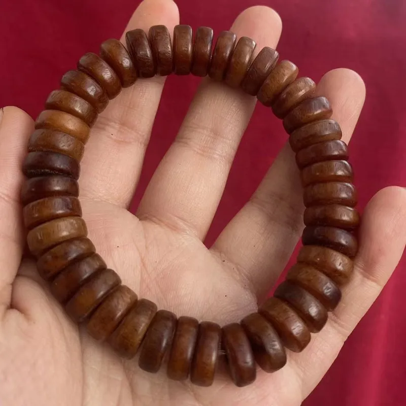 -style medicinal yak bone and hand-held string of prayer beads from the Tibetan region