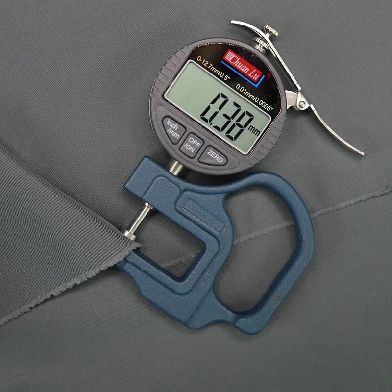 Autumn and winter solid color polyester shiny silk twill windbreaker jacket woven fabric sewn windbreaker jacket clothing fabric