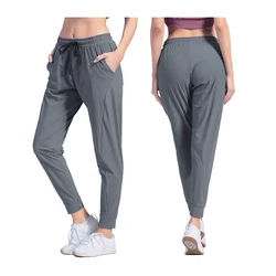 Vrouwelijke sportkledingbroek Nylon sneldrogende hardloopbroek Causaal ademend Zak met trekkoord Yoga Joggers Dames joggingbroek